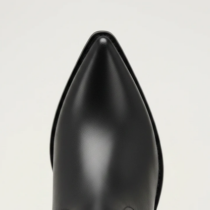 Yehaw black vegan leather knee-high cowgirl boots with pointed toe and medium heel. Zip fastening.