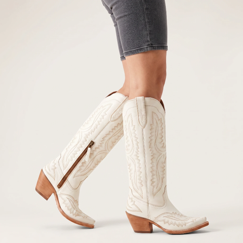 Yehaw white knee-high vegan leather cowgirl boots with pointed toe, side zip, and western-style embroidery