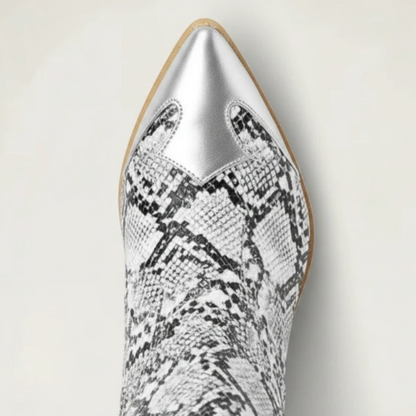 Yehaw Clementine knee-high cowboy boots in silver and black snakeskin-print vegan leather with a pointed toe