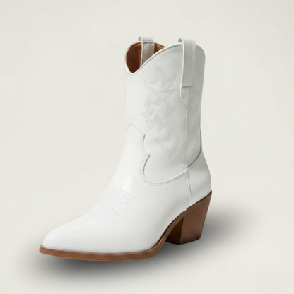 Yehaw CARLA white vegan leather ankle cowgirl boots with pointed toe and medium heel worn by a woman in denim shorts
