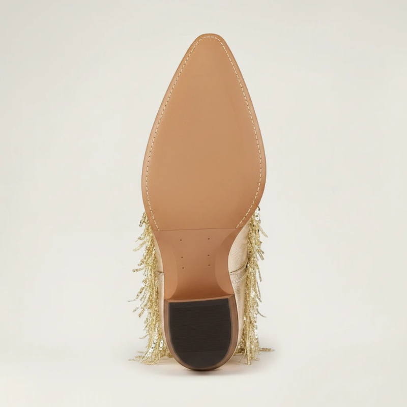 Yehaw gold vegan leather mid-calf cowgirl boots with long shimmering fringe and a pointed toe.