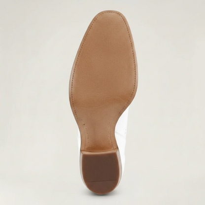 Yehaw white vegan leather cowgirl boots with perforated details and a medium block heel.