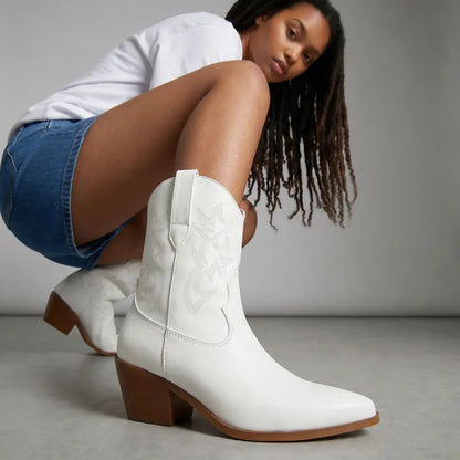 Yehaw white vegan leather ankle-height cowgirl boots with pointed toe and medium heel.