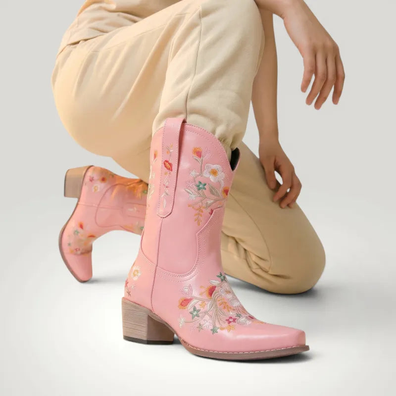 Yehaw pink vegan leather ankle-height cowboy boots with floral embroidery and pointed toe.