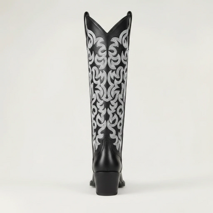 Yehaw CELIA black vegan leather mid-calf cowgirl boots with intricate silver western embroidery and a pointed toe.