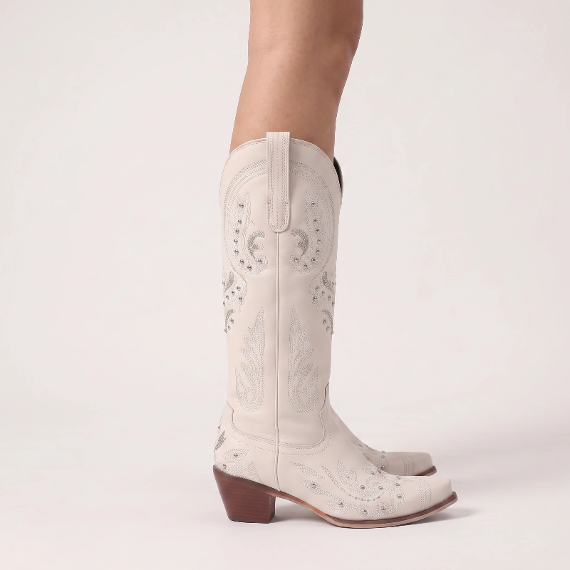 Yehaw beige vegan leather mid-calf cowgirl boots with intricate silver embroidery, side zip, and a pointed toe.