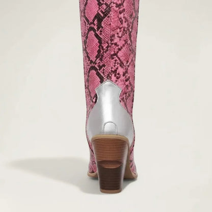 Yehaw Clementine knee-high cowgirl boots in pink snakeskin vegan leather with silver heel detail and stacked block heel