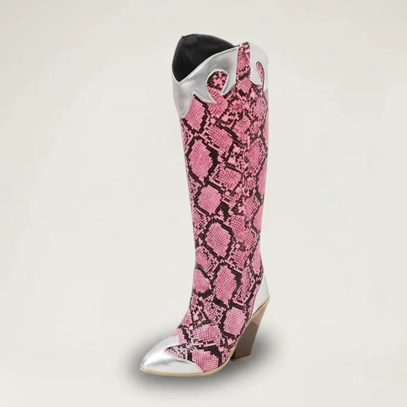 Yehaw Clementine knee-high cowgirl boots in pink snakeskin vegan leather with silver metallic accents and pointed toe.