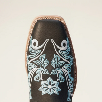 Yehaw Adriana black vegan suede mid-calf cowgirl boots with intricate light blue floral embroidery and a round toe.
