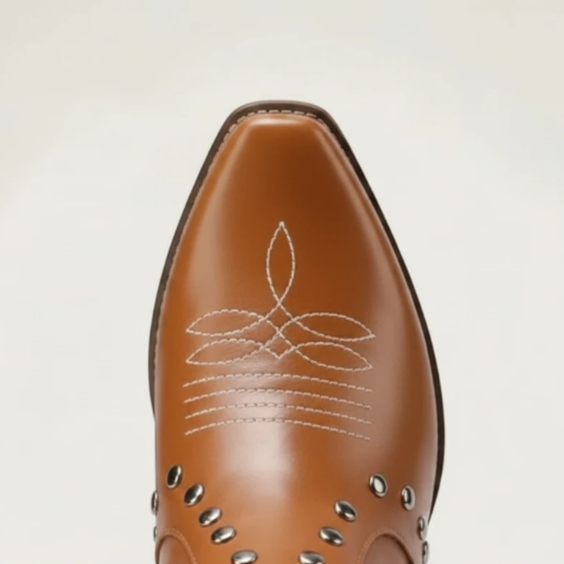 Yehaw brown vegan leather ankle cowboy boots for women with white fringe, star cutouts, and silver stud details.
