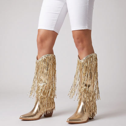 Yehaw gold vegan leather mid-calf cowgirl boots with long shimmering fringe and a pointed toe.