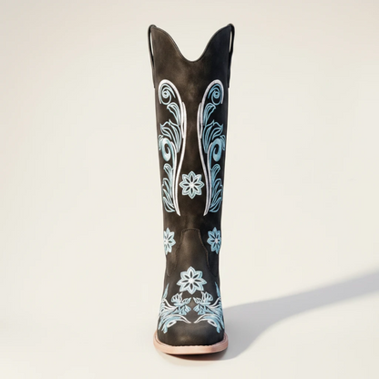 Yehaw Adriana black vegan suede mid-calf cowgirl boots with intricate light blue floral embroidery and a round toe.