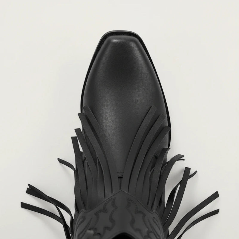 Yehaw DALIA black vegan leather ankle cowgirl boots with fringe detailing and a pointed toe on a neutral background.