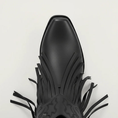 Yehaw DALIA black vegan leather ankle cowgirl boots with fringe detailing and a pointed toe on a neutral background.