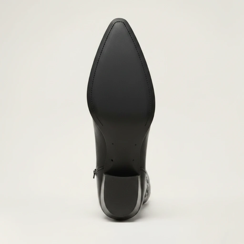 Yehaw black vegan leather knee-high cowgirl boots with pointed toe and medium heel. Zip fastening.
