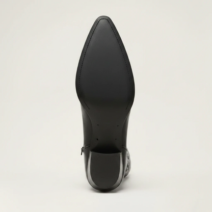 Yehaw black vegan leather knee-high cowgirl boots with pointed toe and medium heel. Zip fastening.