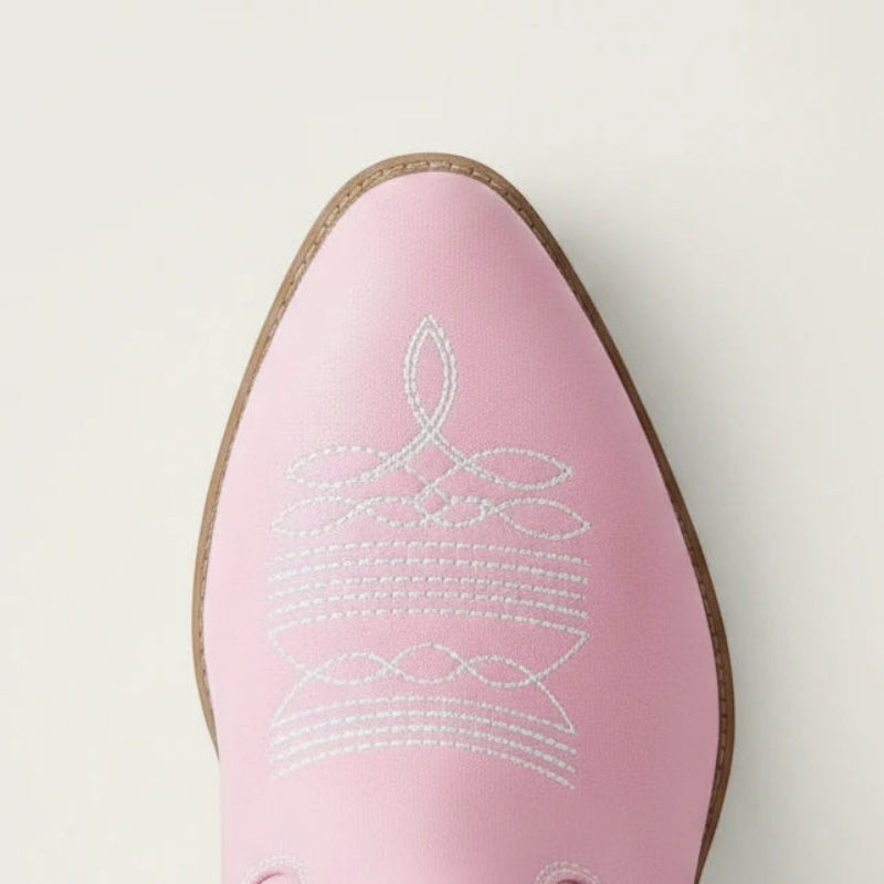 Yehaw pink vegan leather ankle cowgirl boots with white western stitching and a pointed toe
