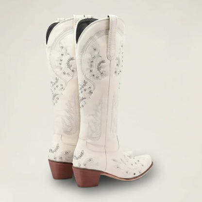 Yehaw beige vegan leather mid-calf cowgirl boots with intricate silver embroidery, side zip, and a pointed toe.