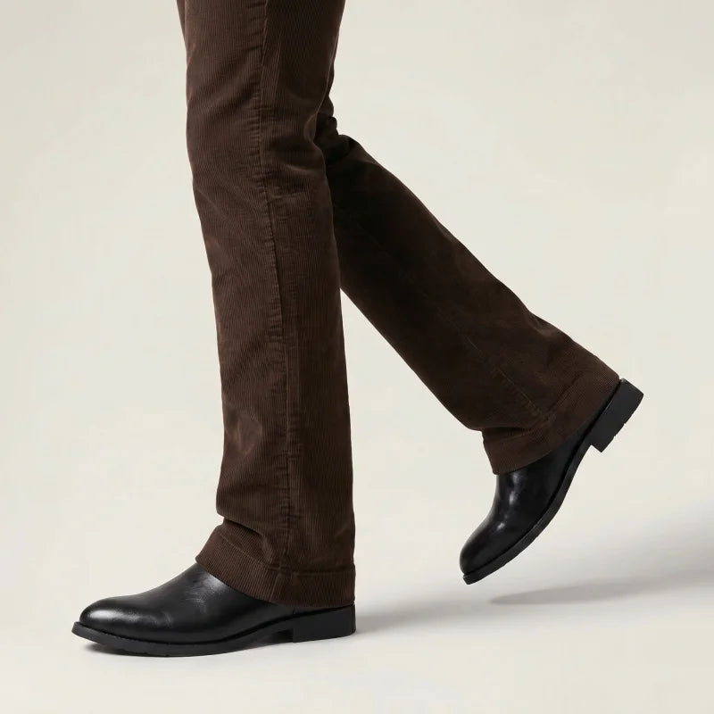 Yehaw JIMMY men's black vegan leather ankle cowboy boots with pointed toe and low heel worn with brown corduroy trousers