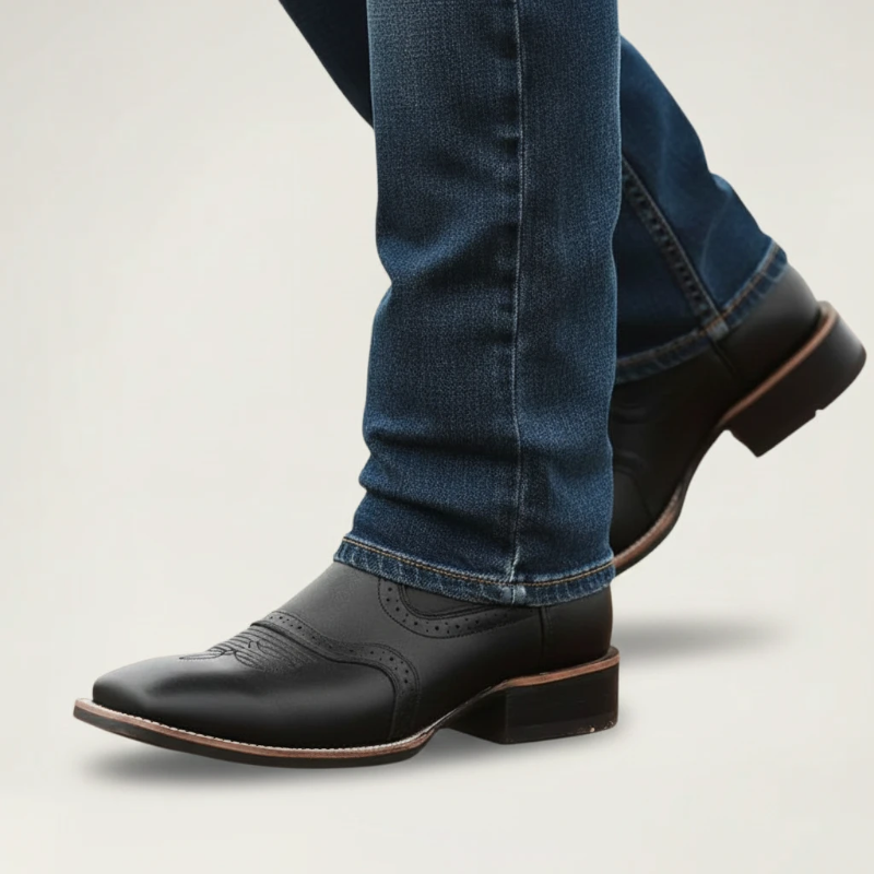 Yehaw black vegan leather cowboy boots with square toe and rubber sole, showing the bottom view