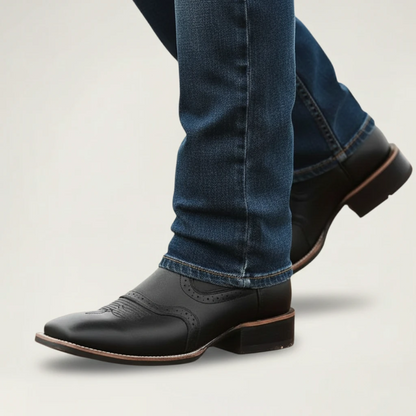 Yehaw black vegan leather cowboy boots with square toe and rubber sole, showing the bottom view