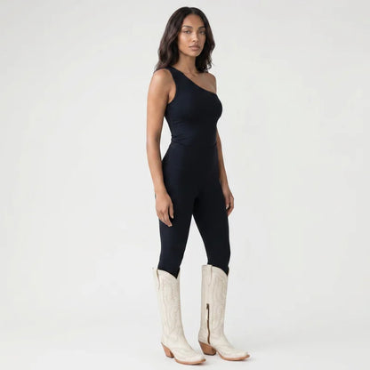 Model wearing Yehaw white vegan leather knee-high cowgirl boots with pointed toes and side zip closure