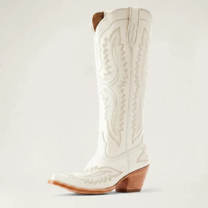 Yehaw white knee-high vegan leather cowgirl boots with pointed toe, western stitching, and stacked block heel.