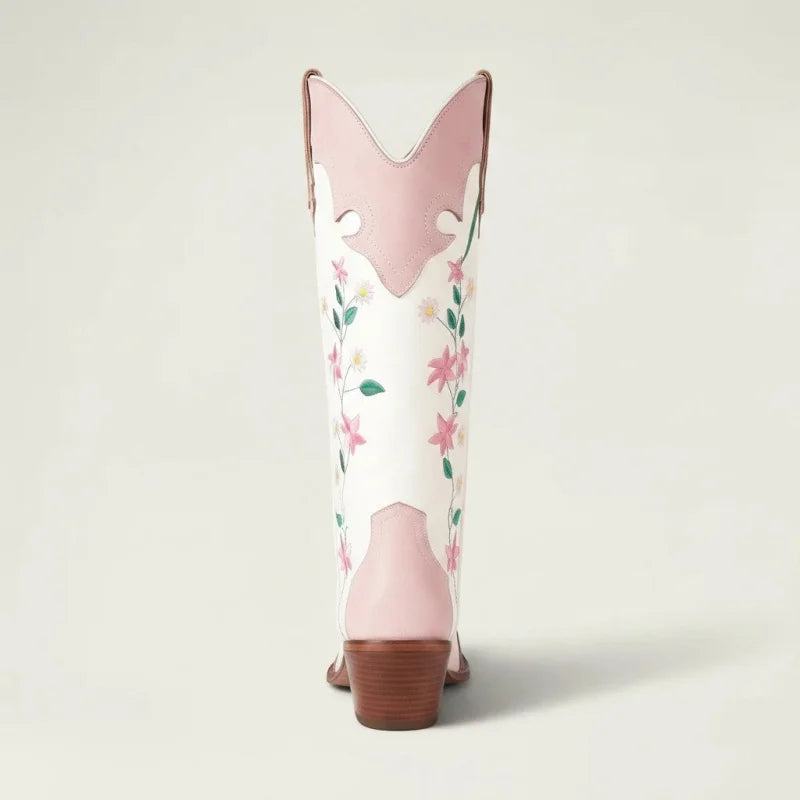 Yehaw RIA knee-high white vegan leather cowgirl boots with pink floral embroidery and a high block heel, back view.
