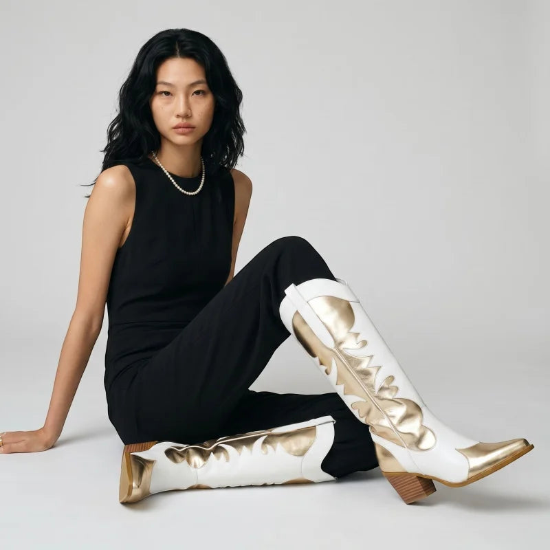 Model wearing Yehaw white and gold vegan leather mid-calf cowgirl boots with a round toe and medium heel.