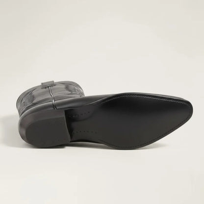 Yehaw black vegan leather cowboy boots with a pointed toe and low rubber heel, viewed from the sole
