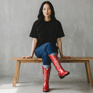 Yehaw red vegan leather mid-calf cowgirl boots with white stitching and pointed toe. Slip-on style with a medium heel.
